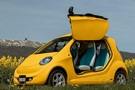 Yellow Softcar reveal vehicle